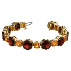 Spessartite and Red Garnet Tennis Bracelet, 54.87 Carats Total in Yellow Gold
